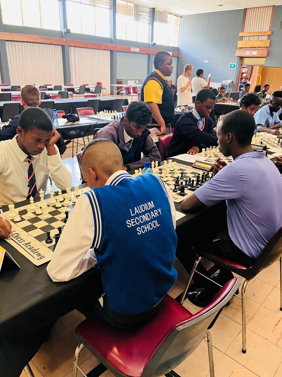 Learners in Laudium Secondary School chess jackets competing at a tournament